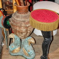 A range of canes in an interesting vase
